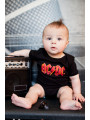 AC/DC Baby Onesie sitting on guitar amp